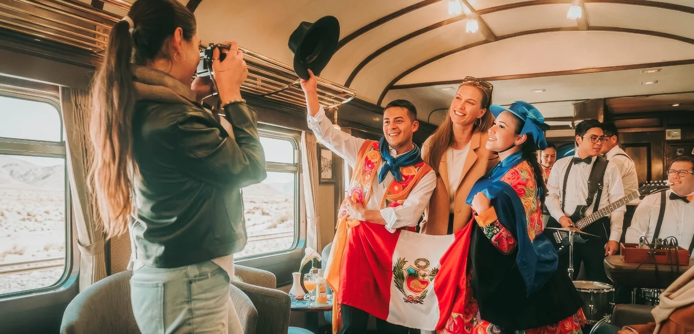 Passengers and traditional dances inside the Vistadome Observatory train