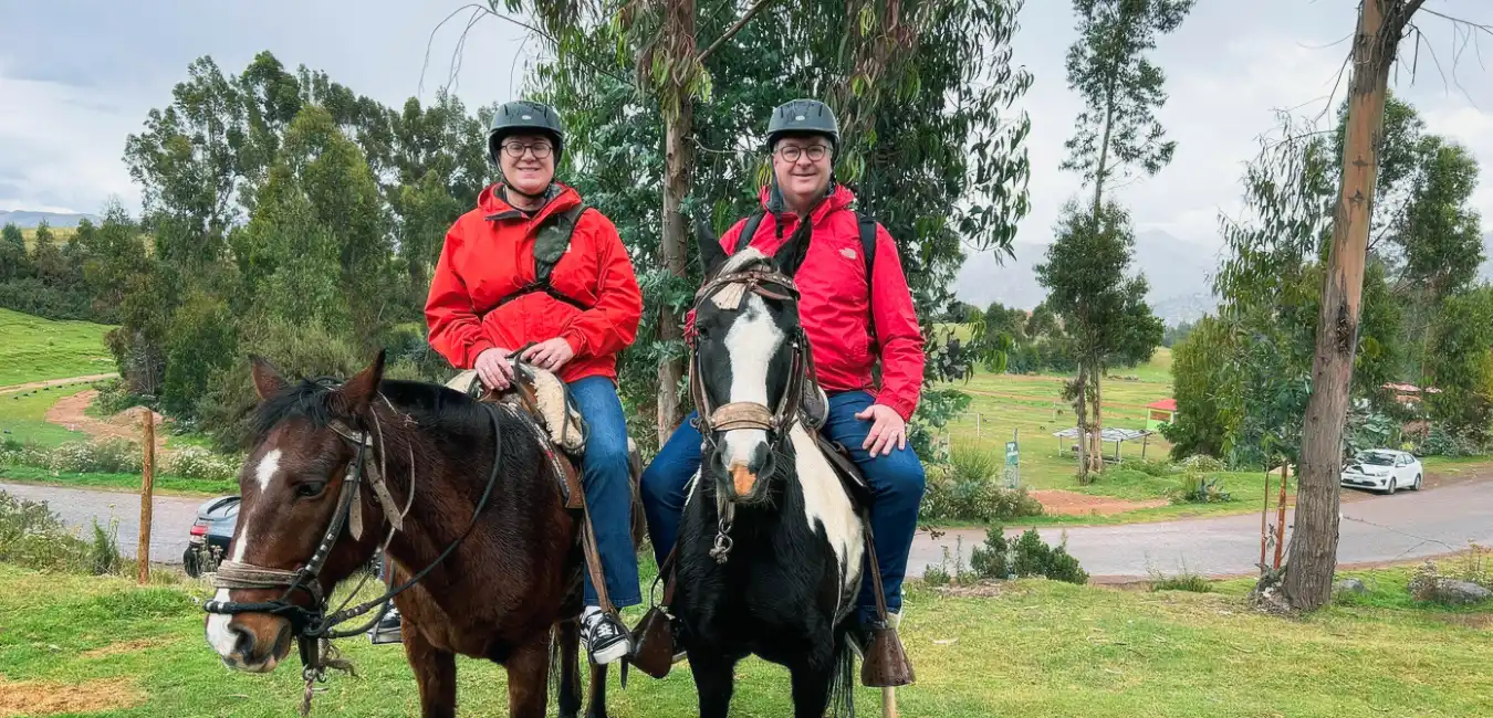 Horseback riders near the Temple of the Moon in Cusco