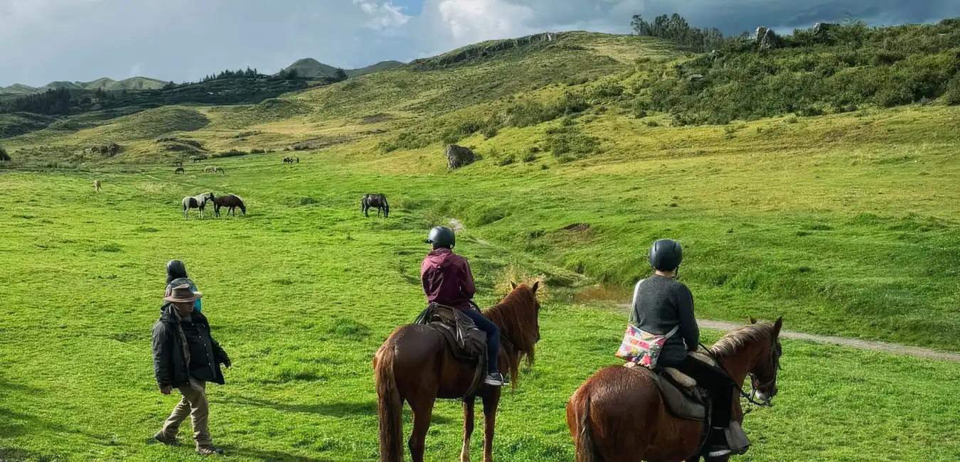 Horseback riders near the Temple of the Moon in Cusco