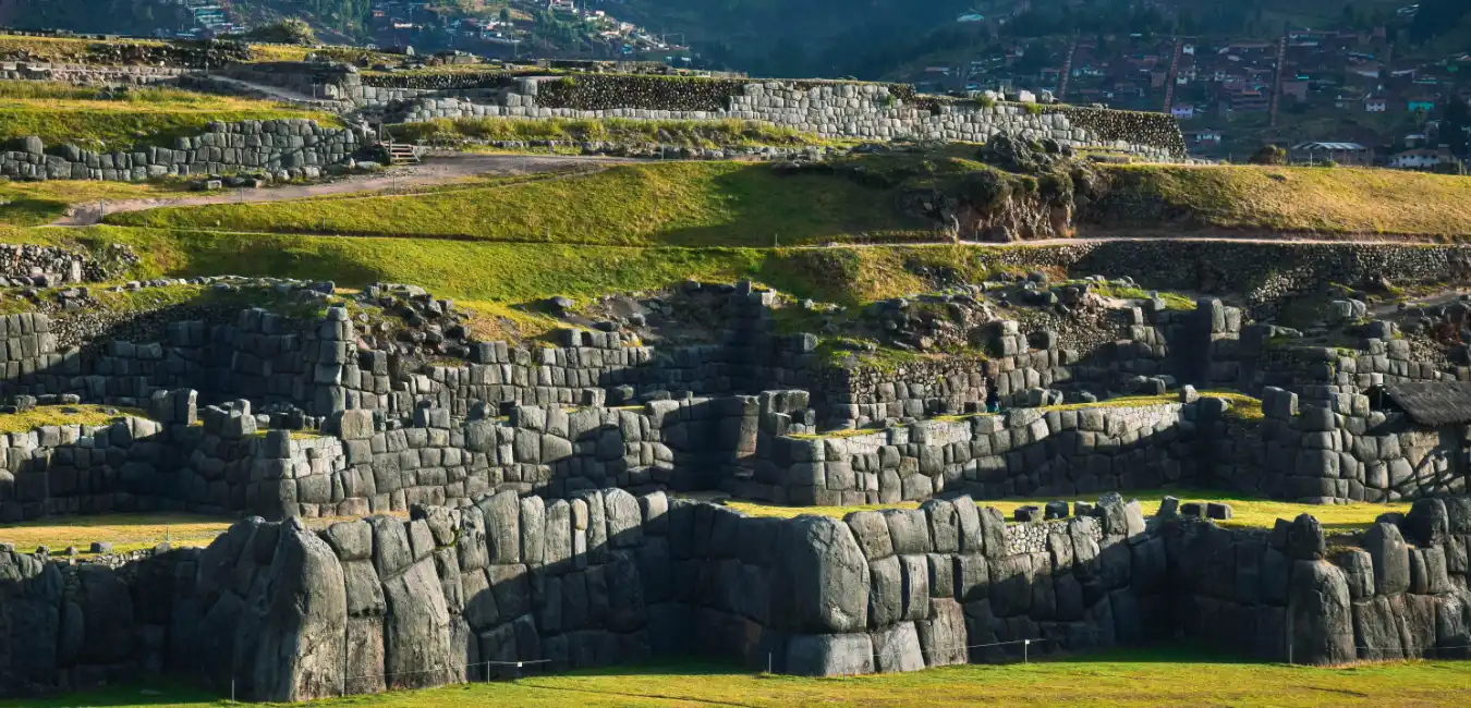 Massive stone walls of the Sacsayhuaman Inca fortress overlooking the city of Cusco, Peru.