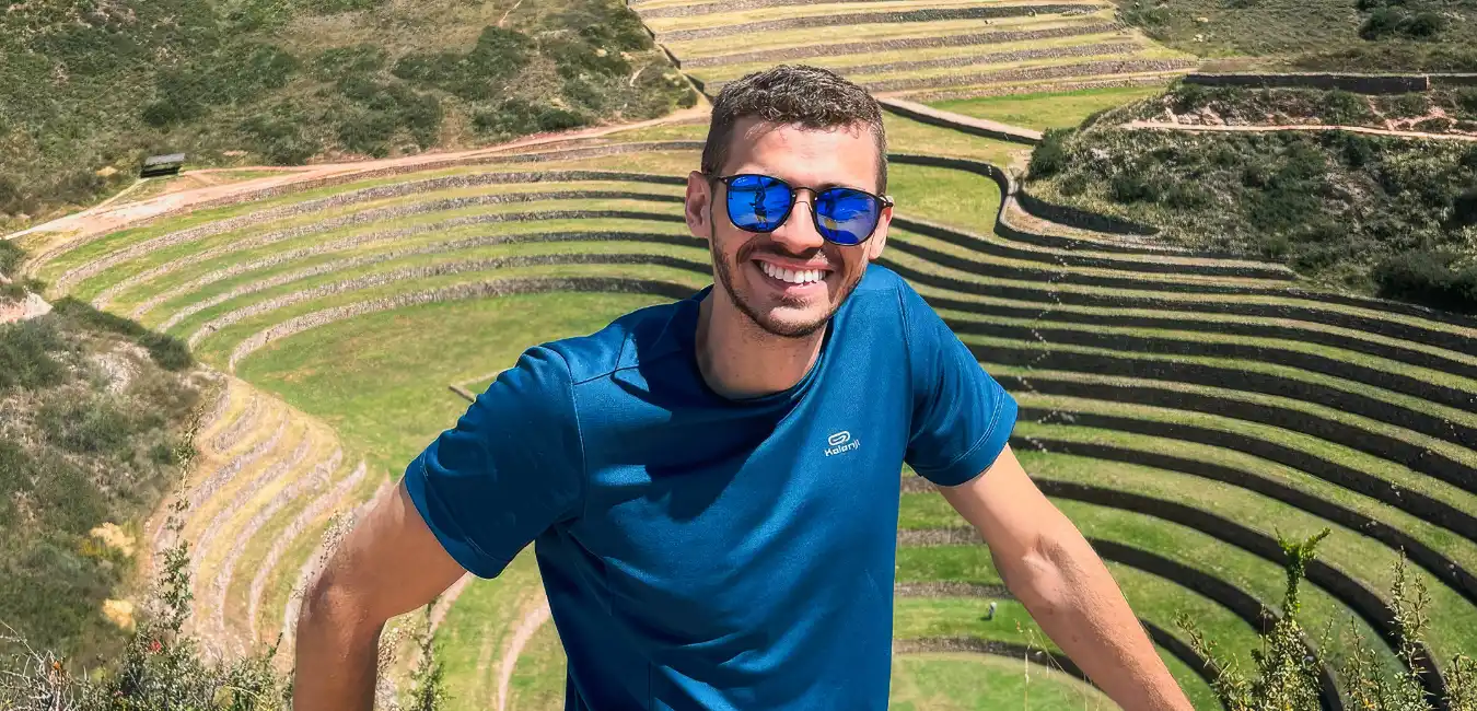 Tourist standing at the Moray Inca terraces in Cusco