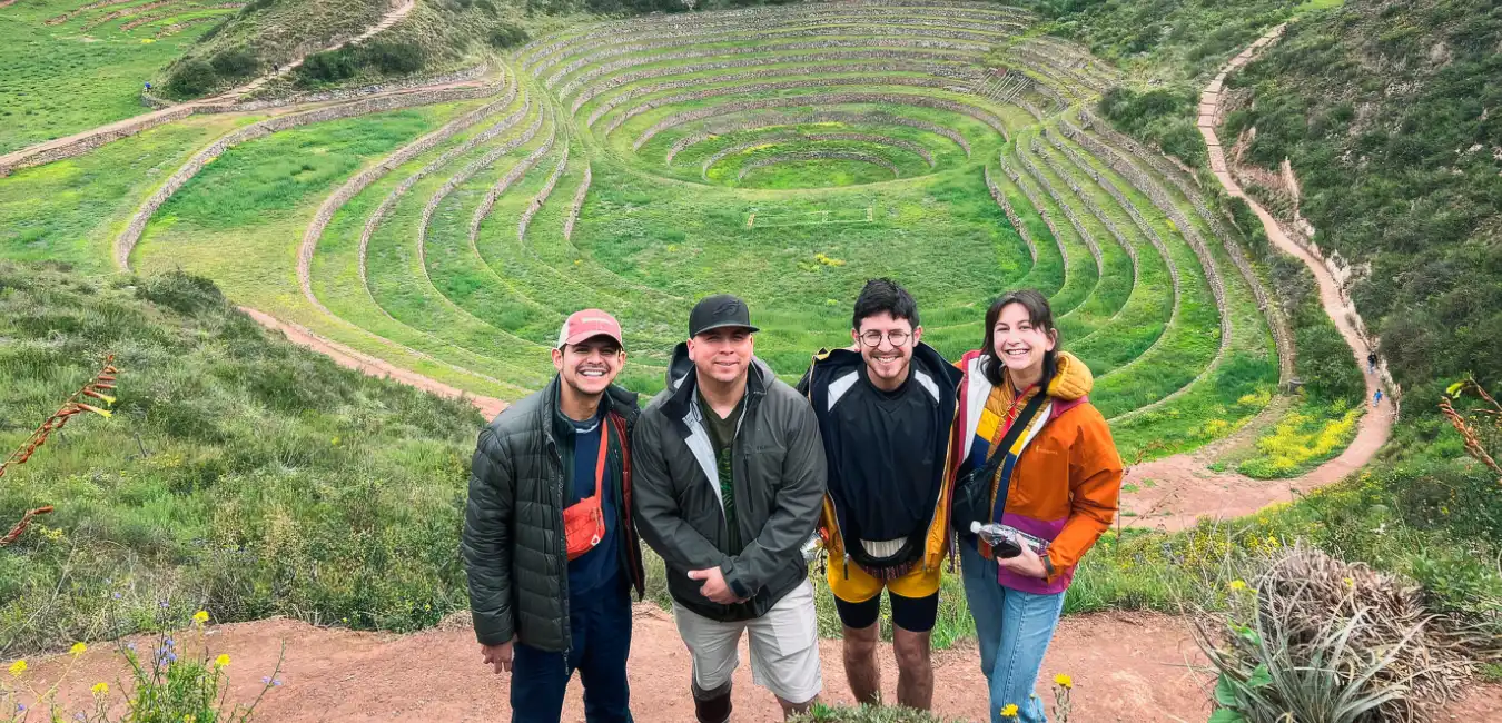 Tourists visiting the circular Inca terraces of Moray in Cusco