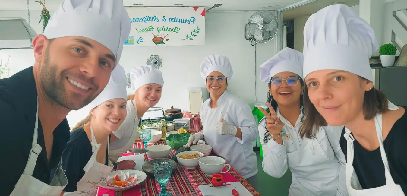 tourists preparing traditional Peruvian dishes during a hands-on cooking class with fresh local ingredients in Lima 