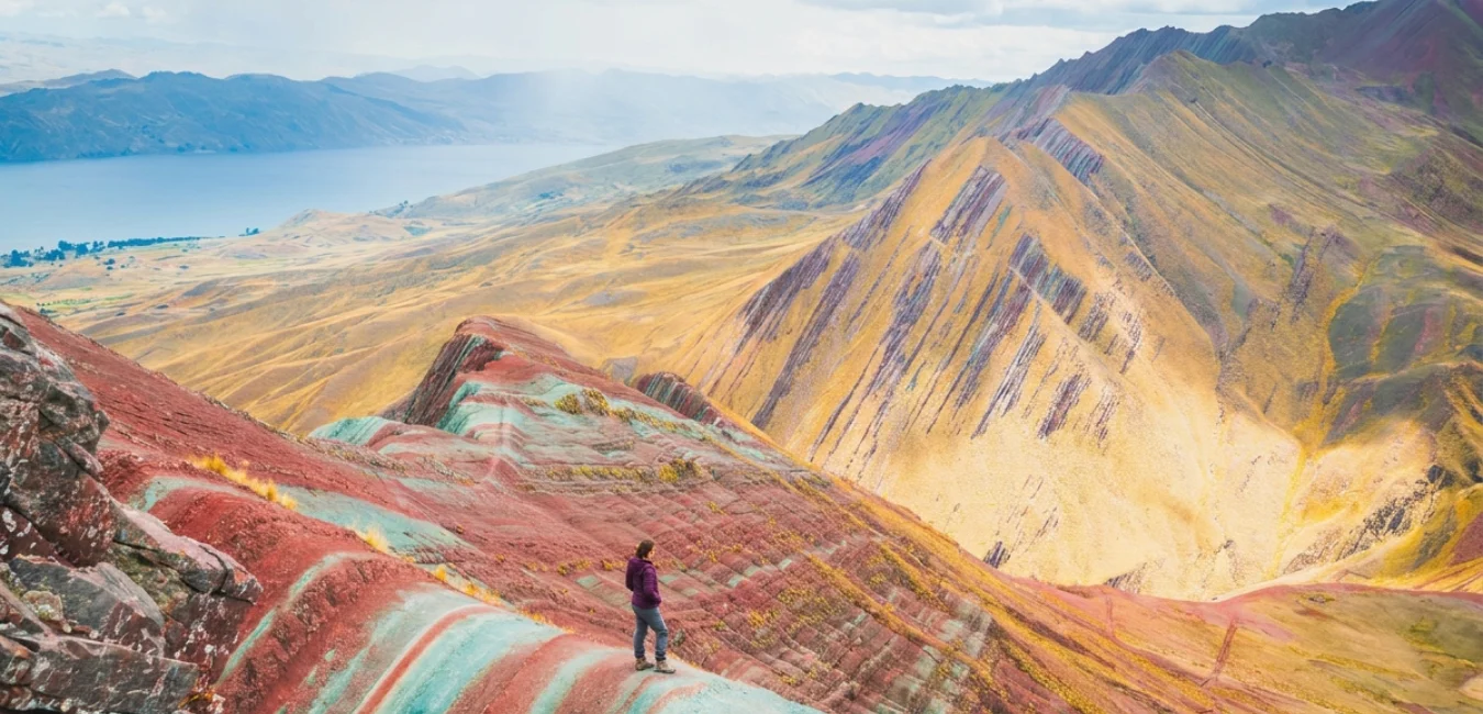 Traveler enjoying panoramic views during the Pallay Punchu Full Day Tour near Cusco, Peru
