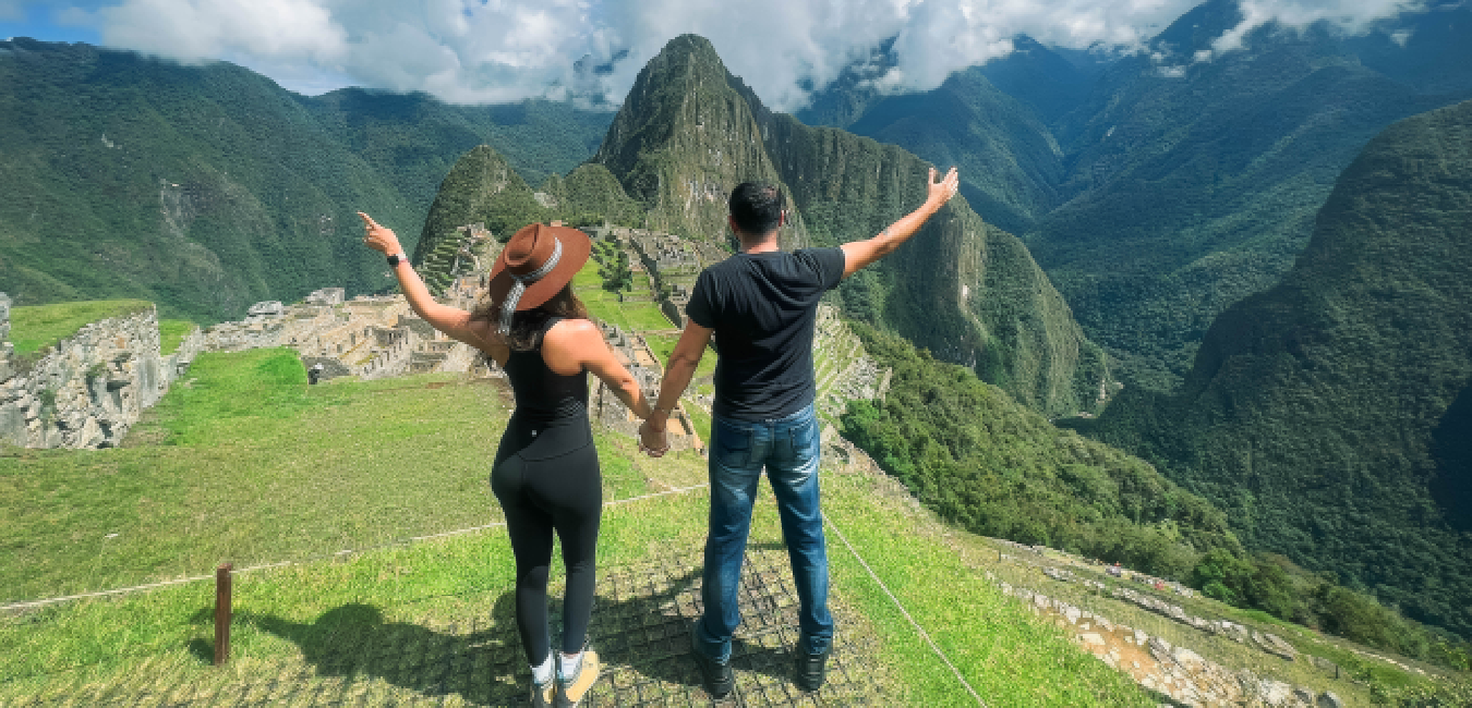 Couple visiting Machu Picchu during their Peru trip