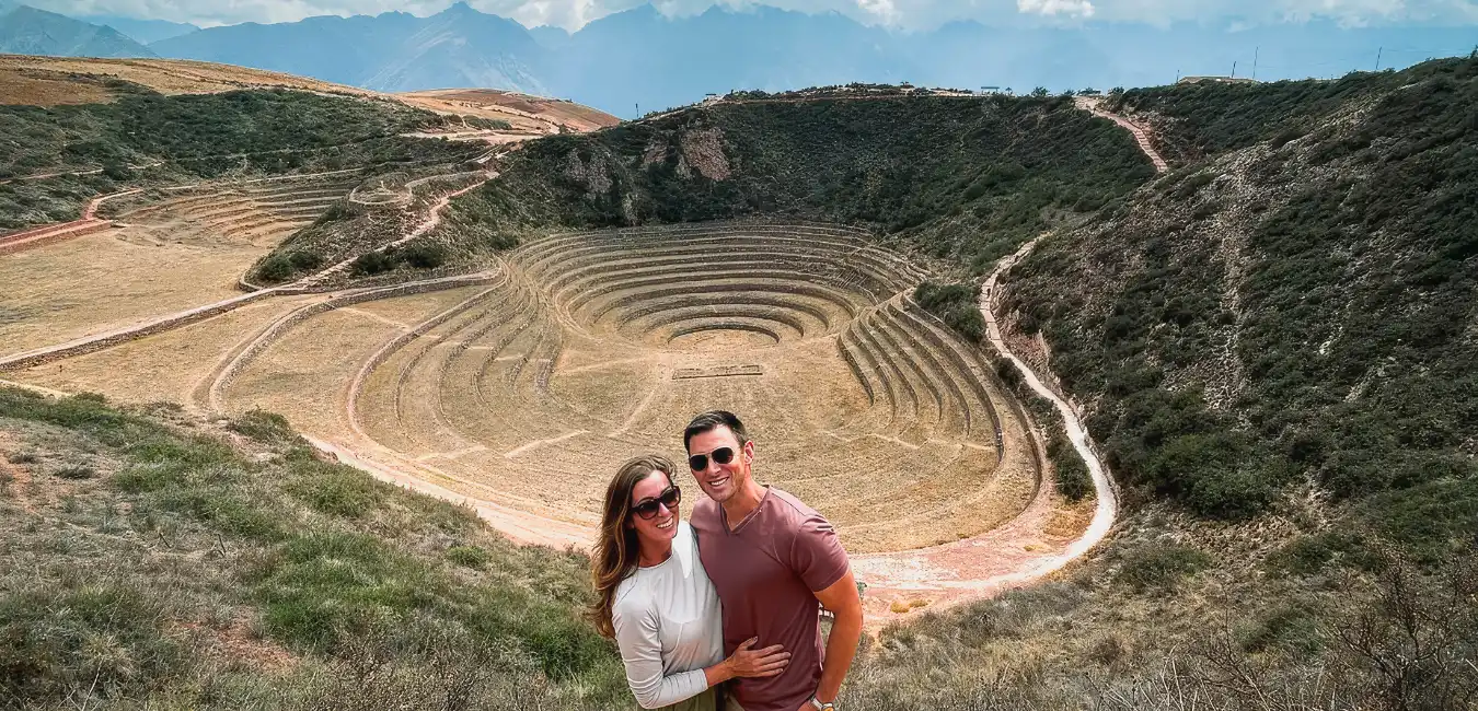 Visitors exploring the circular Inca terraces of Moray  