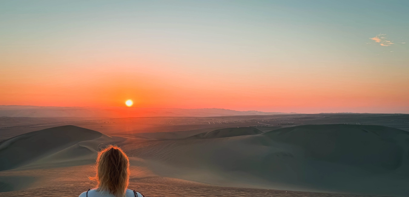 Beautiful sunset over the sand dunes near Huacachina 