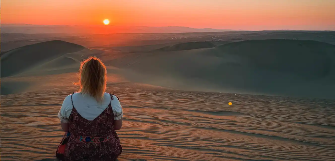 Huacachina Oasis surrounded by desert sand dunes in Ica 