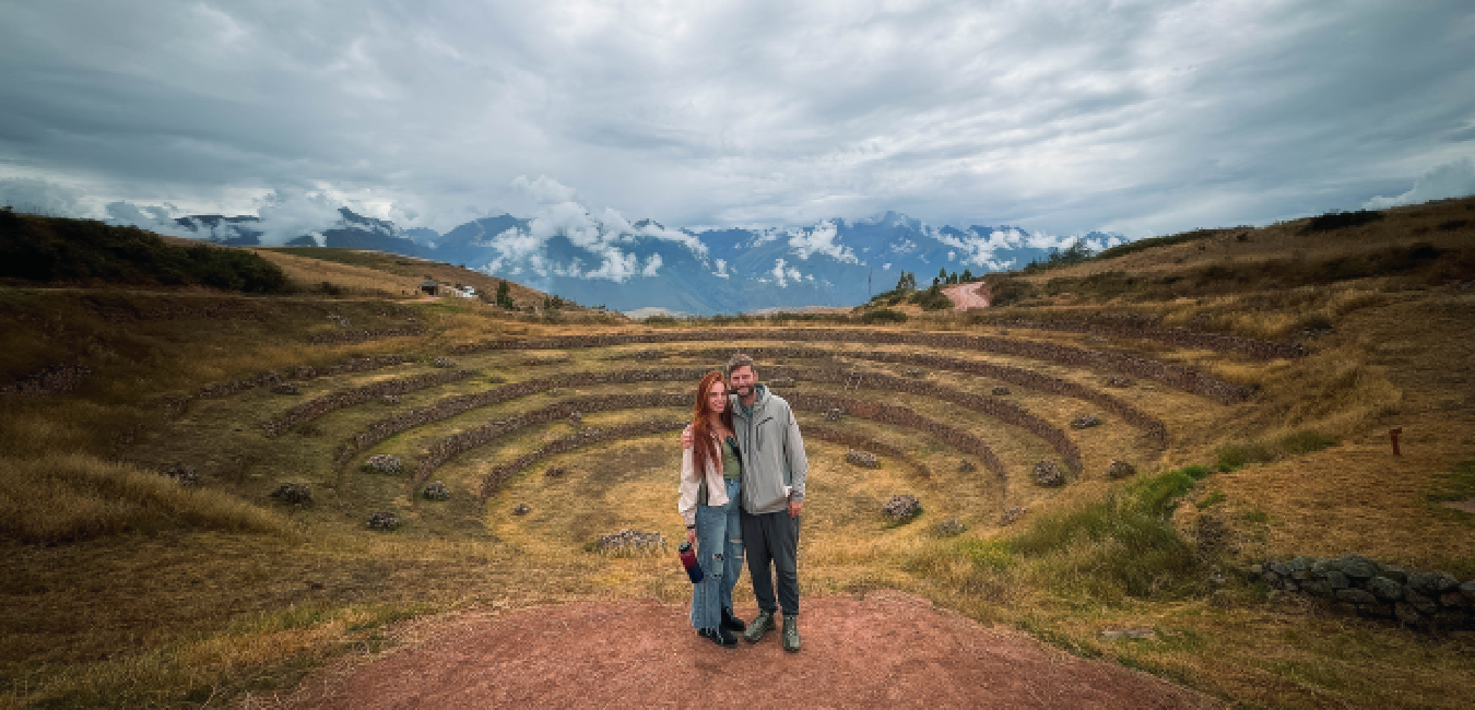 Tourists exploring the Moray Inca terraces in the Sacred Valley, Peru