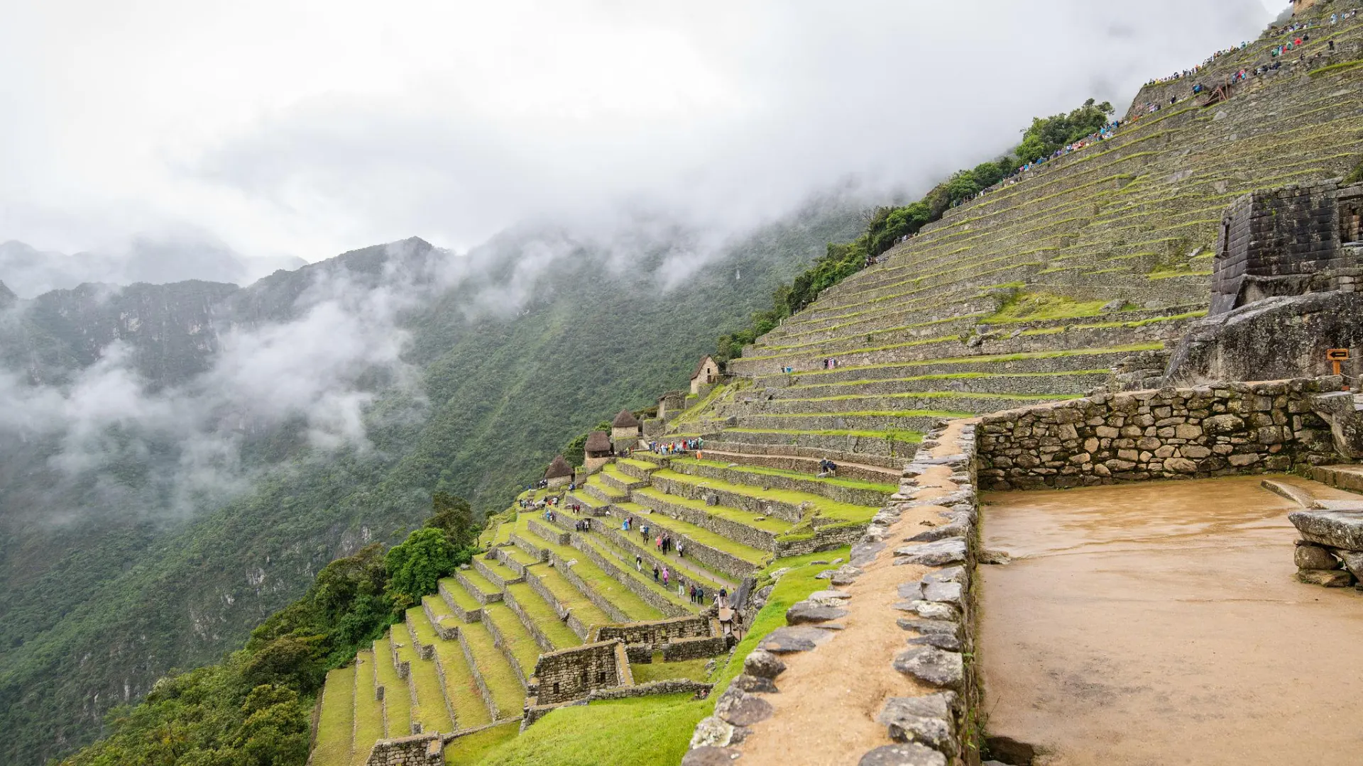 Machu Picchu surrounded by mist during the rainy season