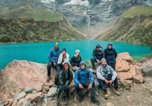 Tourists relaxing at Humantay Lake 