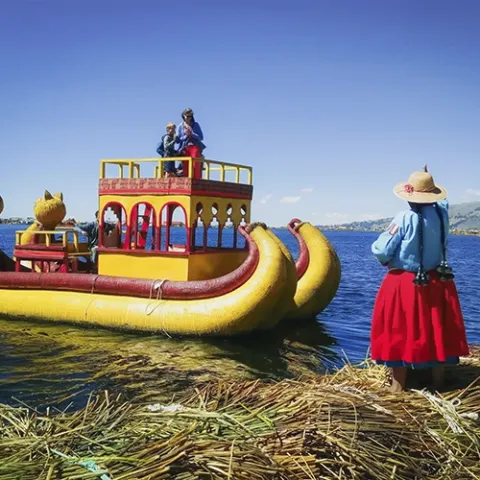 Puno Peru tours to explore Lake Titicaca, the Uros Floating Islands, Taquile, Amantani, and Sillustani