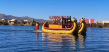 Puma shaped totora reed boat sailing across lake Titicaca