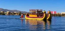 Puma shaped totora reed boat sailing across lake Titicaca